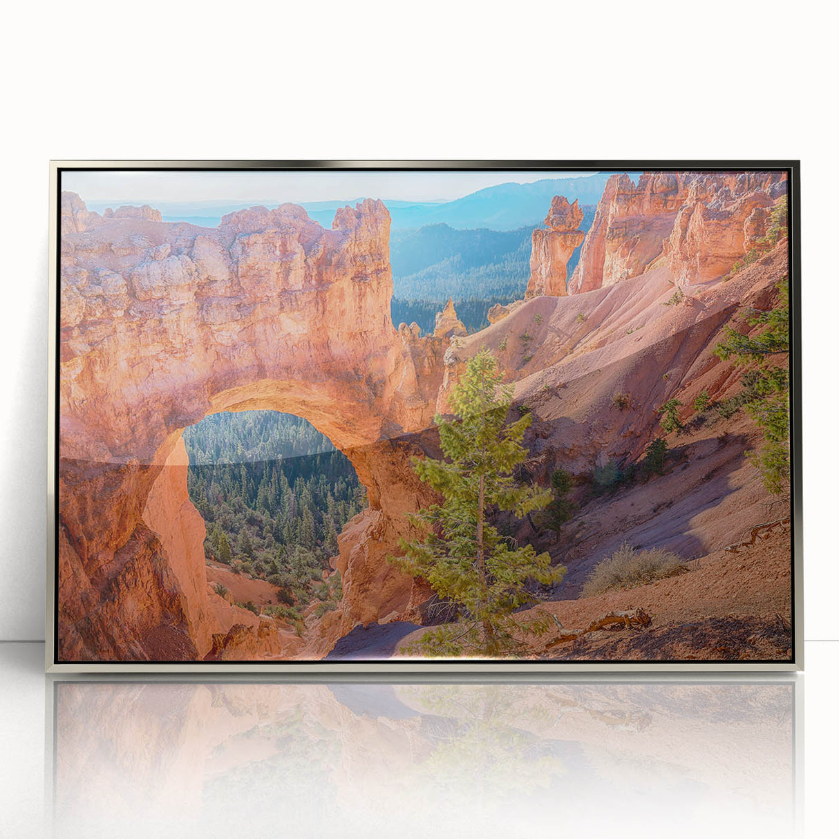Mid-century modernist art of Bryce Canyon in silver-framed acrylic, featuring earthy red and orange tones.