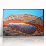 Mid-century modernist art depicting Canyonlands in muted earth tones on a silver-framed acrylic print.