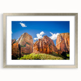 Textured art print of Zion National Park in muted earth tones on a framed canvas, ideal for modern bedroom ambiance.