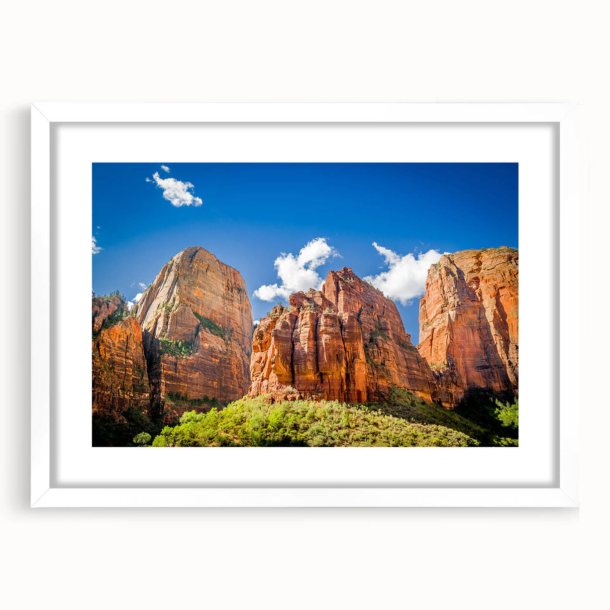 Abstract art print of Zion National Park in muted earth tones, framed in white, suitable for dining room or bedroom decor.
