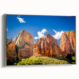 Framed canvas of a Zion National Park landscape painting, featuring vibrant colors and black accents.