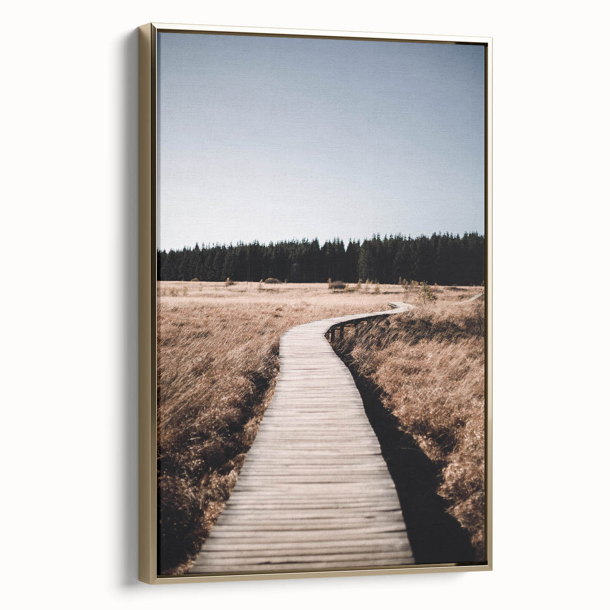 Framed canvas featuring a vintage poster-style landscape art painting of autumn trees in gold and black tones.