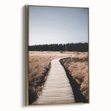 Framed canvas featuring a vintage poster-style landscape art painting of autumn trees in gold and black tones.