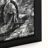 Close-up of a black wall art canvas featuring colorful, textured architectural design, ideal for living room decor.