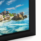 Close-up of extra large black wall art featuring a colorful, textured African scenery on a framed canvas.