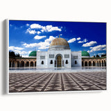 Vintage poster art of a Tunisian landscape on framed canvas, featuring vibrant earth tones, ideal for living room decor.