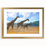 Extra large abstract art print depicting a textured African scenery in muted earth tones, framed in gold.