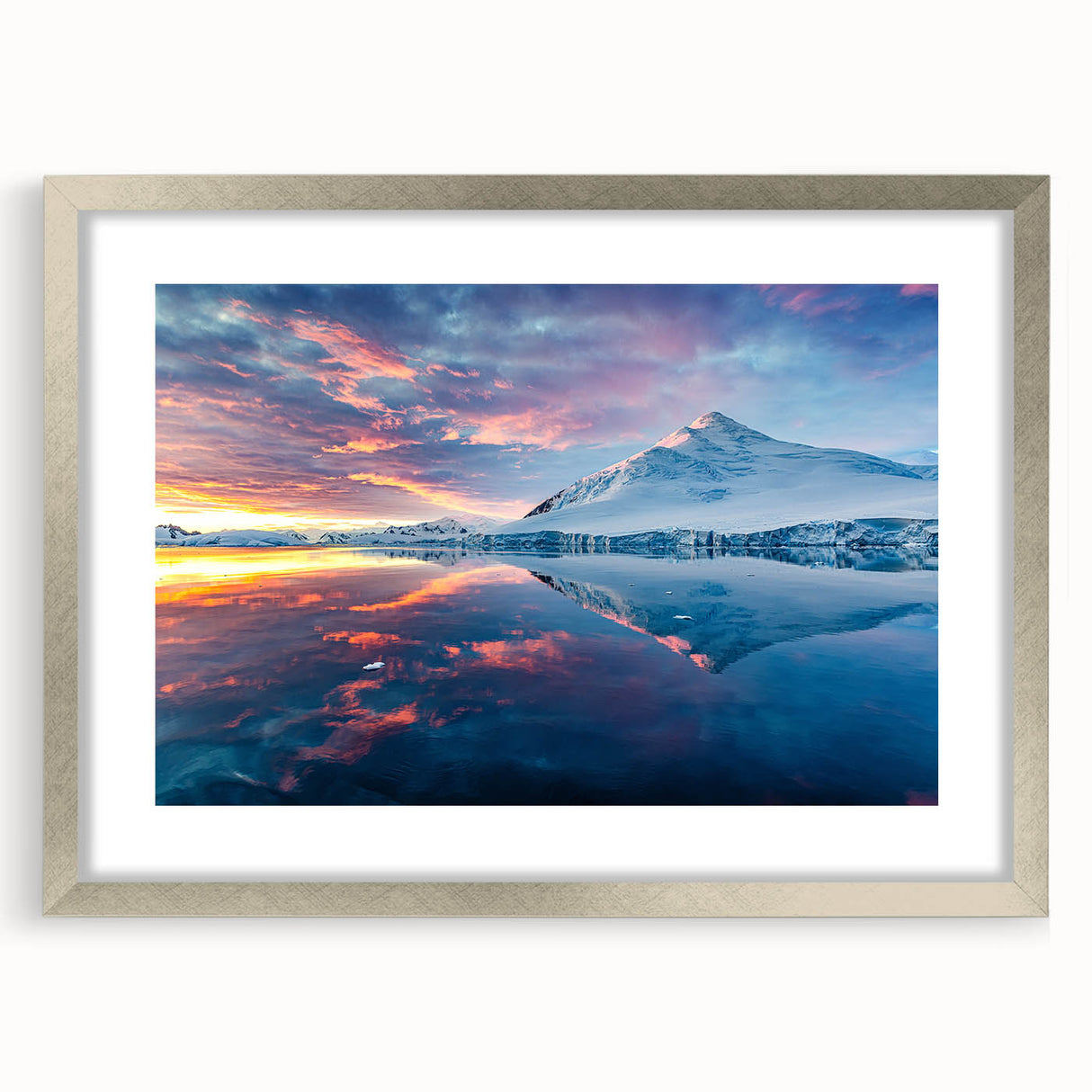 Textured abstract art print of an Antarctic landscape in muted blue and white, framed in silver, ideal for bedroom art.