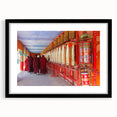 Extra large abstract art print of a colorful Bhutanese landscape on textured canvas, framed in black.