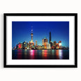 Extra large abstract art print of Shanghai skyline in vibrant colors on a textured canvas, framed in black.