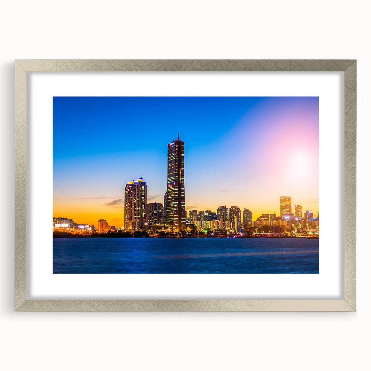 Textured abstract art print depicting the Seoul skyline in muted gray and blue tones, framed in silver.
