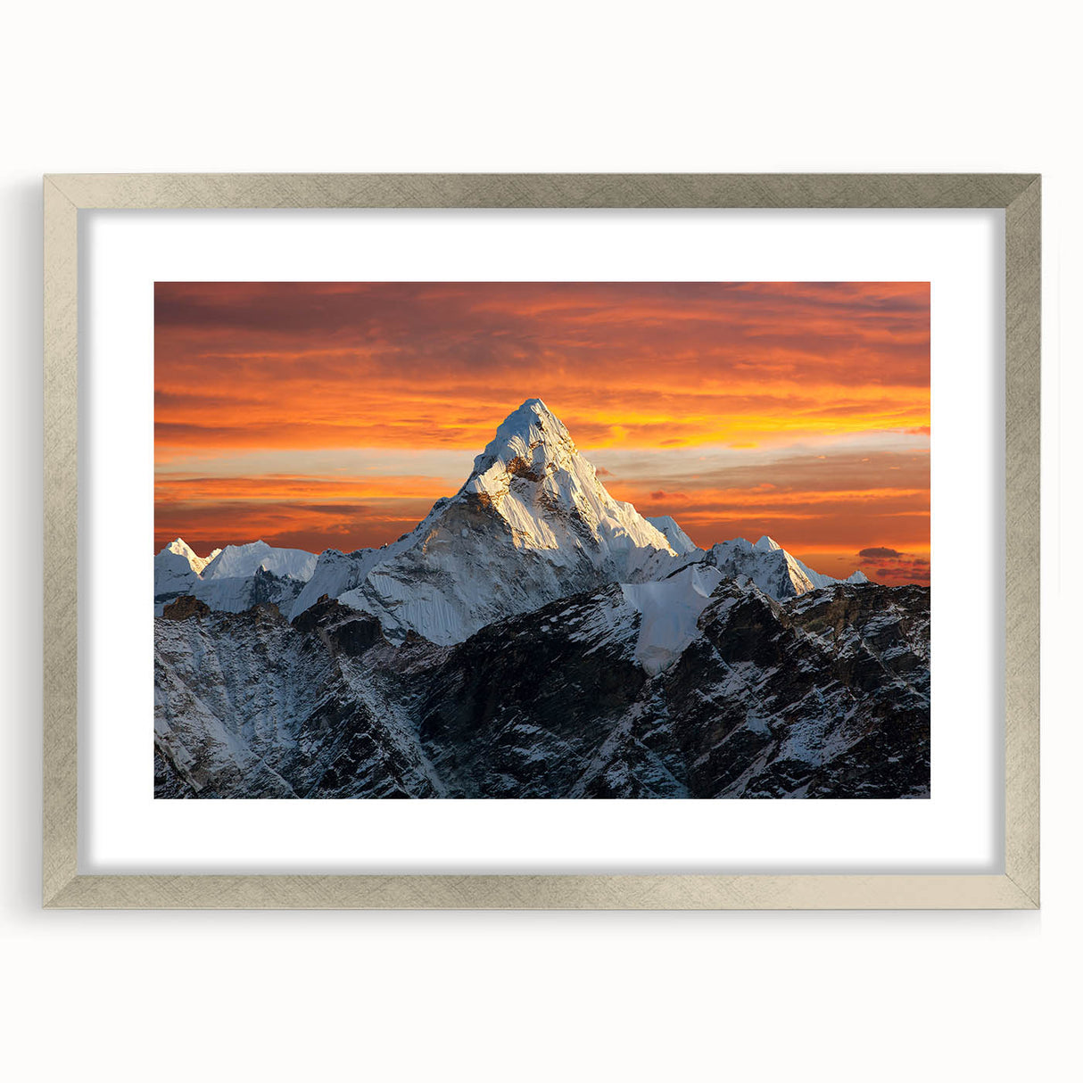 Textured art print of Mount Everest in muted blue and gray tones, framed in silver, ideal for modern bedroom ambiance.