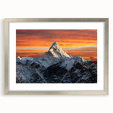 Textured art print of Mount Everest in muted blue and gray tones, framed in silver, ideal for modern bedroom ambiance.
