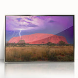 Acrylic print of Ayers Rock in muted earth tones, framed in silver, suitable as modern art wall decor.