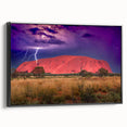 Framed canvas featuring a black and white landscape of Ayers Rock, ideal for bedroom wall art.