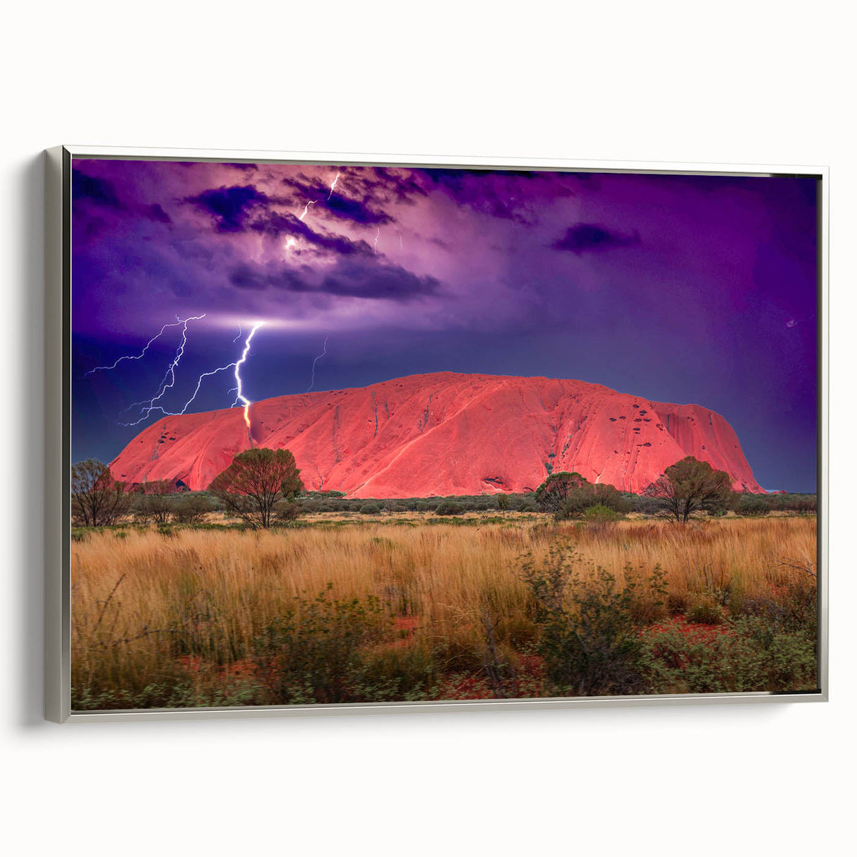 Vintage poster art of Ayers Rock in colorful hues on a large framed canvas, ideal for living room decor.