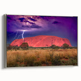 Vintage poster art of Ayers Rock in colorful hues on a large framed canvas, ideal for living room decor.