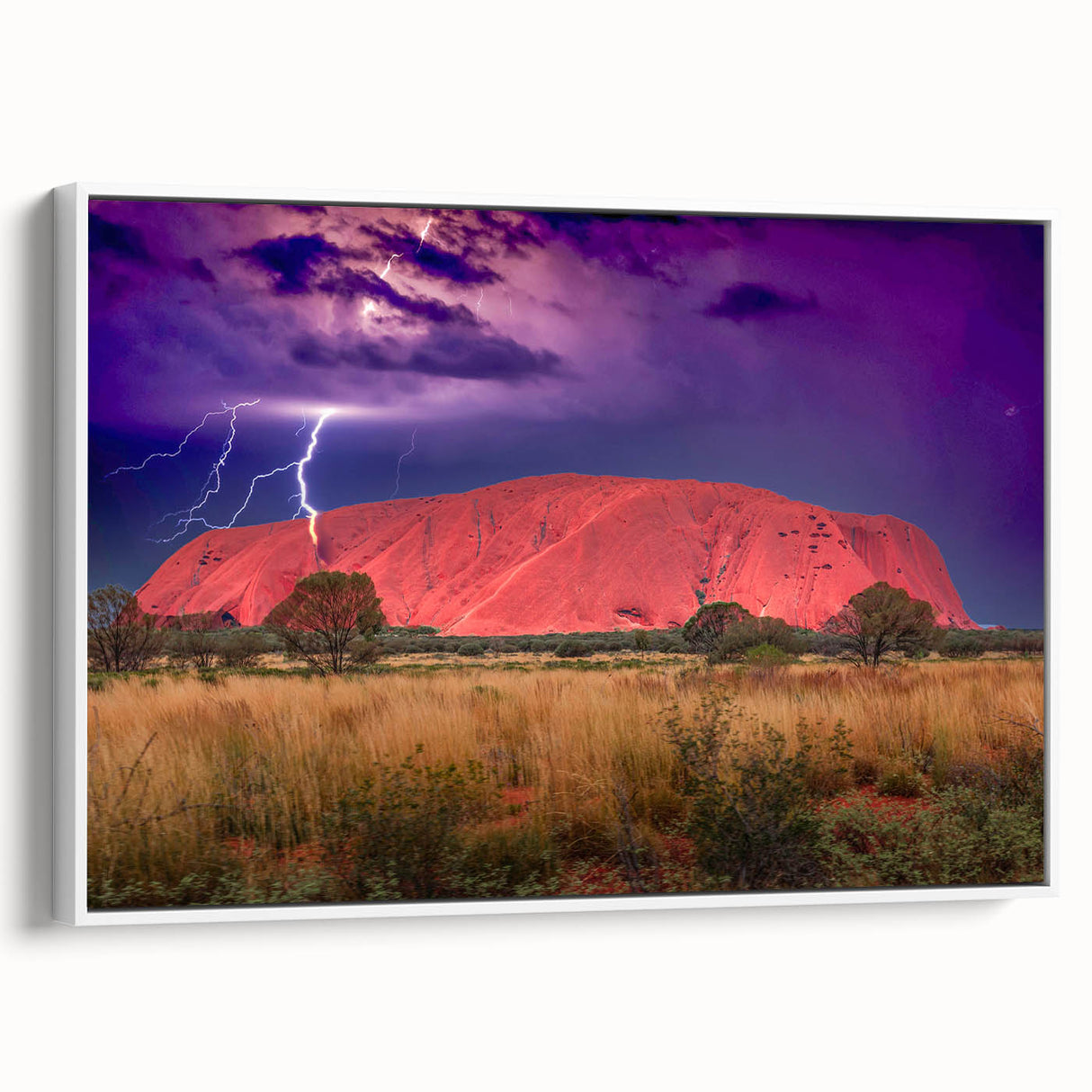 Framed canvas of Ayers Rock landscape in muted earth tones, ideal for bedroom wall art.