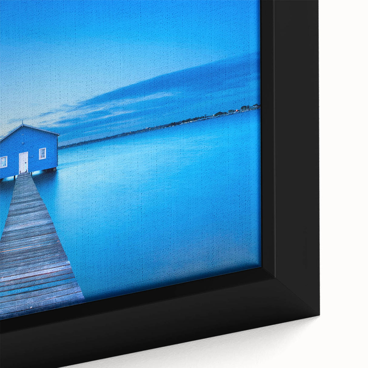 Close-up of a framed canvas featuring a textured depiction of the Perth skyline in black with colorful accents.