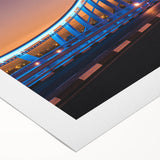 Art Deco poster of Sydney skyline with muted blue and pink tones on rolled canvas, suitable for dining room wall art.