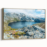 Vintage poster art of a Tasmanian landscape on framed canvas, featuring a blend of colorful art and black tones.