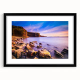Extra large, textured abstract art print of vibrant, colorful scenery, framed in black, ideal for living room decor.