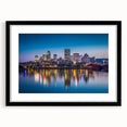 Abstract art print of vibrant, colorful scenery depicting Quebec, on a large textured canvas with a black frame.