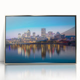 Mid-century modernist art of Quebec scenery in muted gray and blue tones, framed in silver acrylic.