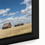 Close-up of black textured wall art featuring a colorful Saskatchewan scenery on a framed canvas.