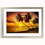Abstract art print depicting a serene Caribbean scene in cool blue and green tones, framed in silver.