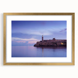 Abstract art print of a Caribbean scene in muted blue and green tones on a framed canvas, suitable for dining room decor.