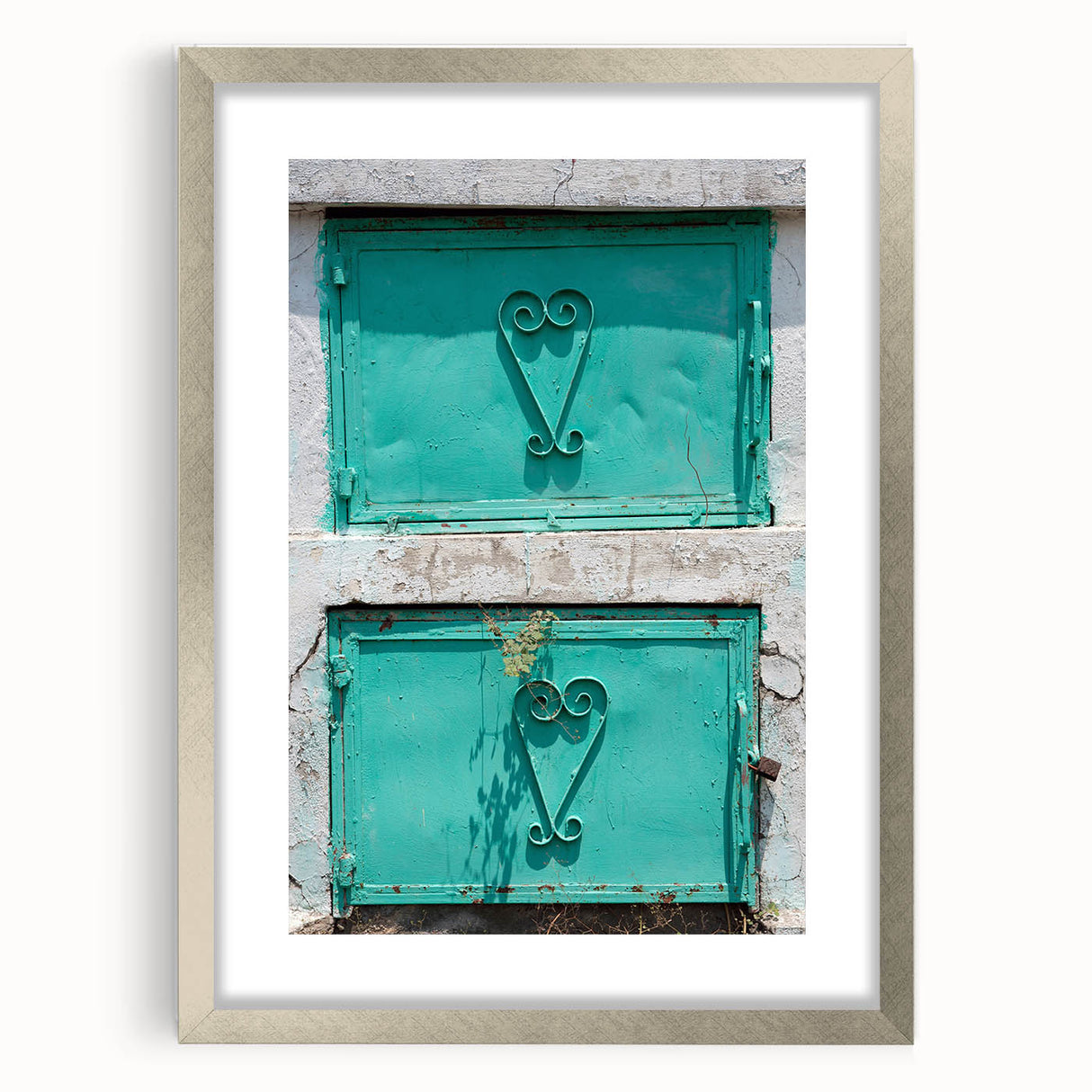 Extra large abstract art print of Caribbean scenery in muted blue and green tones, framed in silver.