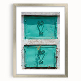 Extra large abstract art print of Caribbean scenery in muted blue and green tones, framed in silver.