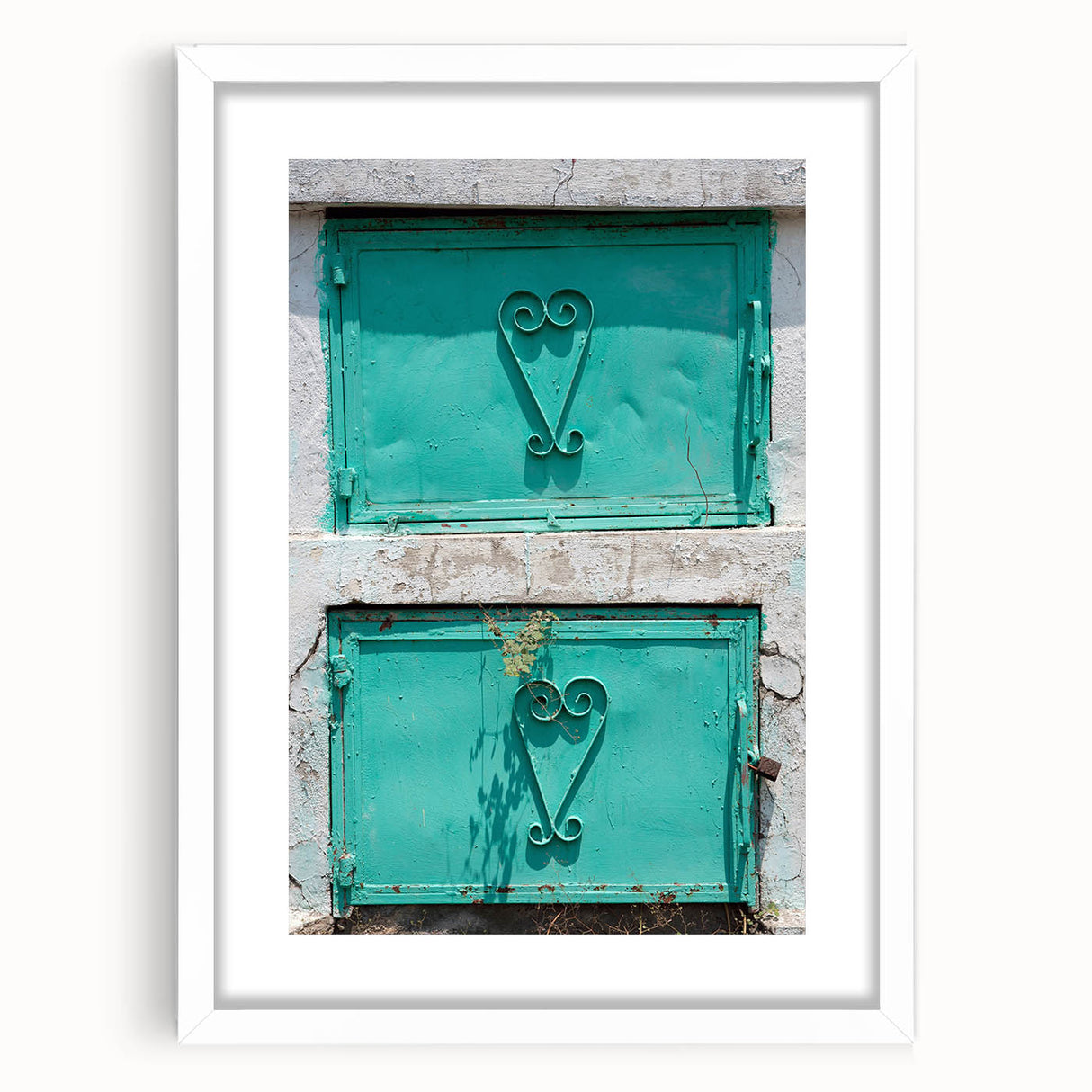 Textured abstract art print of a Caribbean-inspired landscape in muted blue and green tones on a framed white mat.
