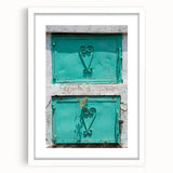 Textured abstract art print of a Caribbean-inspired landscape in muted blue and green tones on a framed white mat.