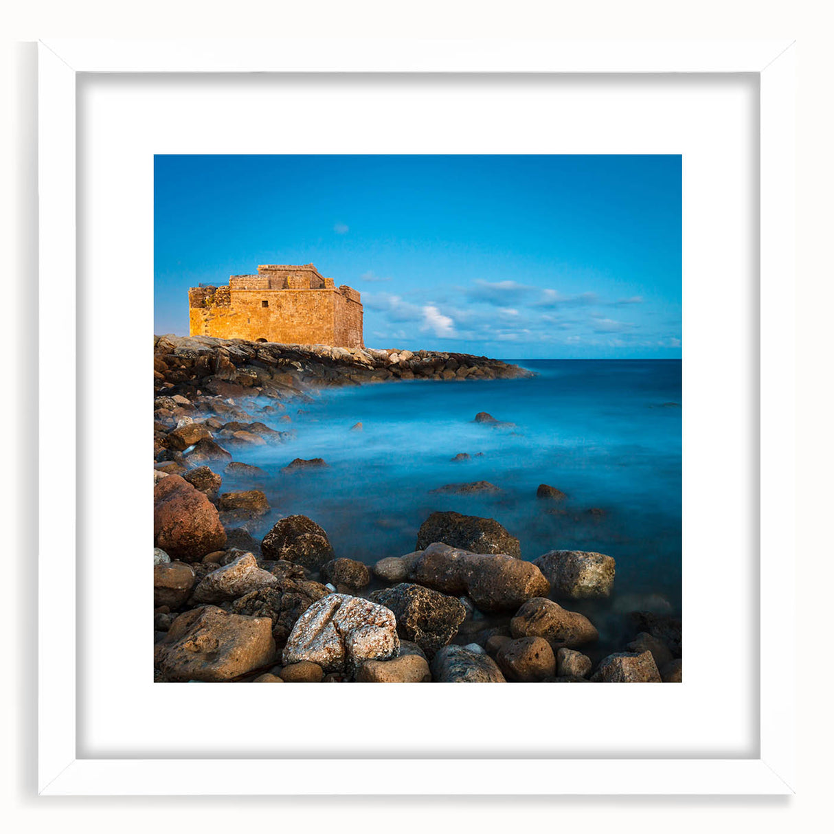 Textured art depicting abstract scenery of Cyprus in muted earth tones on a framed white mat, ideal for bedroom art.