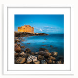Textured art depicting abstract scenery of Cyprus in muted earth tones on a framed white mat, ideal for bedroom art.