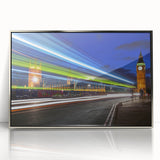 Large art print of the London skyline in muted blue and gray tones on a silver-framed acrylic.