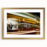 Abstract art print of Piccadilly, England in muted gold and beige tones, framed with a gold mat.