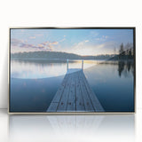 Large art print of a serene Finnish landscape in muted green and blue tones, framed in silver acrylic.