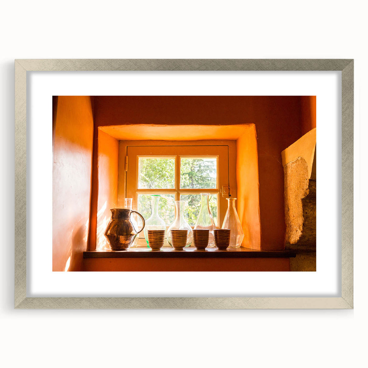 Extra large abstract art print of a textured European landscape in muted earth tones, framed in silver.