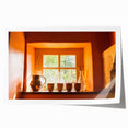 Rolled print of a serene French countryside landscape with soft green and yellow tones.
