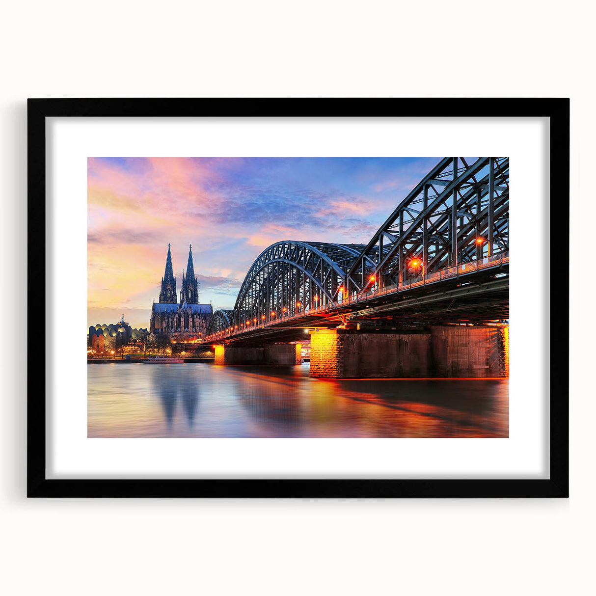 Extra large abstract art print of a vibrant, colorful European scenery on textured canvas, framed in black.