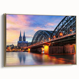 Framed canvas depicting a vintage European landscape in muted gold and black tones, suitable for bedroom wall art.