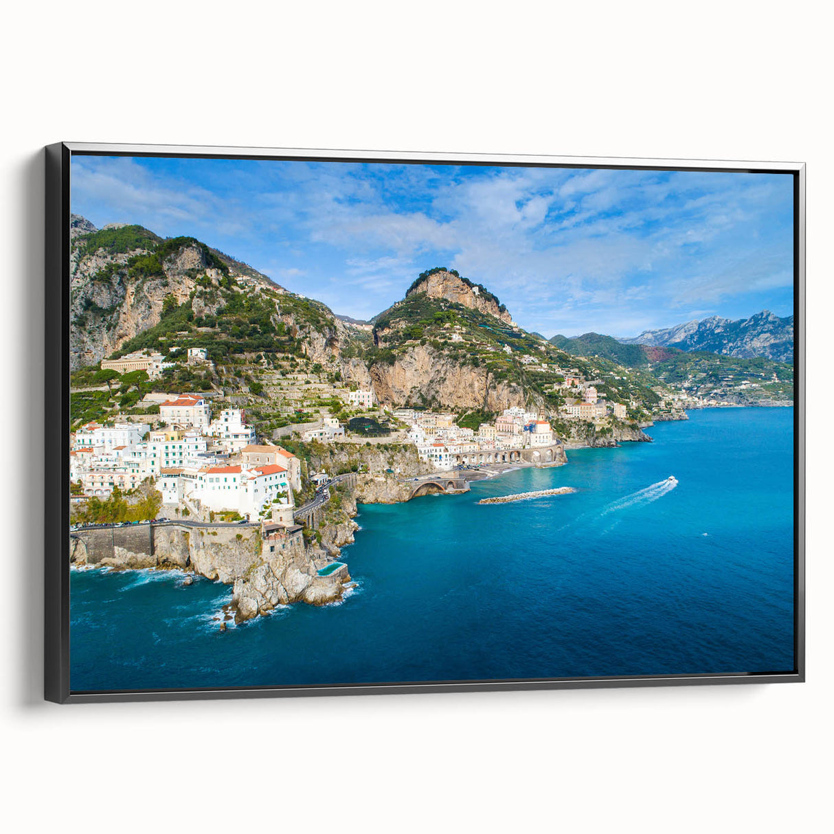 Black and white framed canvas of the Amalfi Coast landscape in a vintage poster style, ideal for bedroom decor.