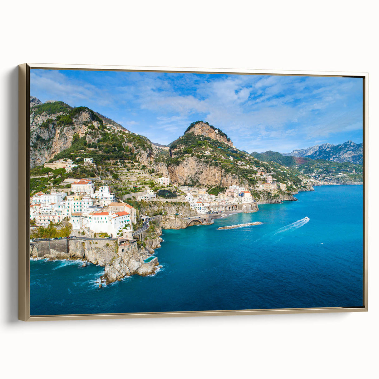 Framed canvas wall art of the Amalfi Coast with vintage poster style, featuring a landscape in black and gold tones.