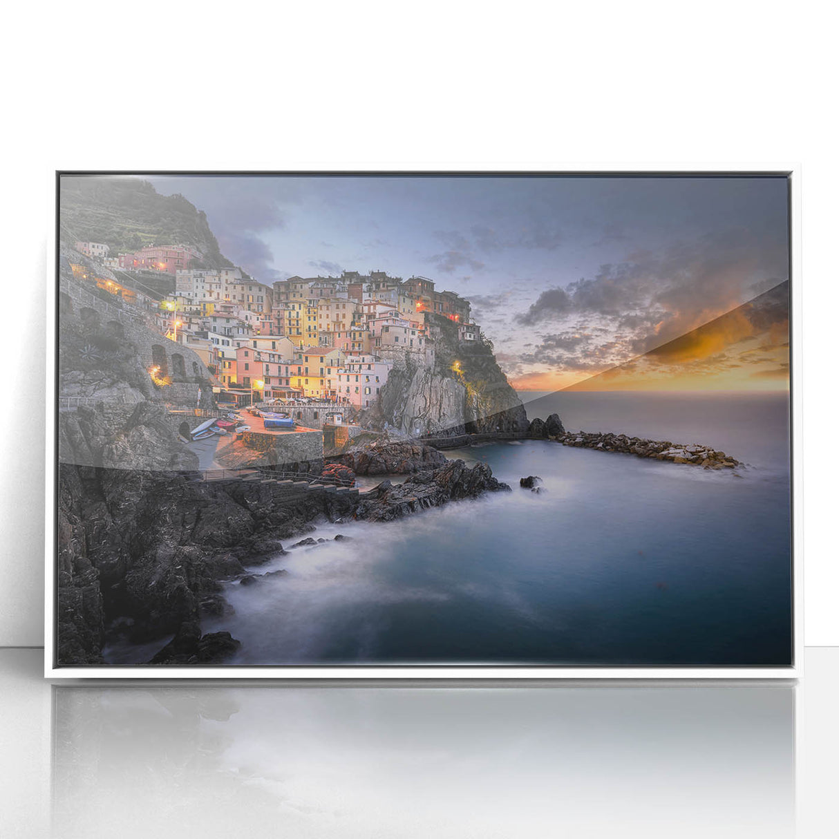 Framed acrylic print of Cinque Terre with pastel colored buildings and calm sea, in mid-century modernist style.