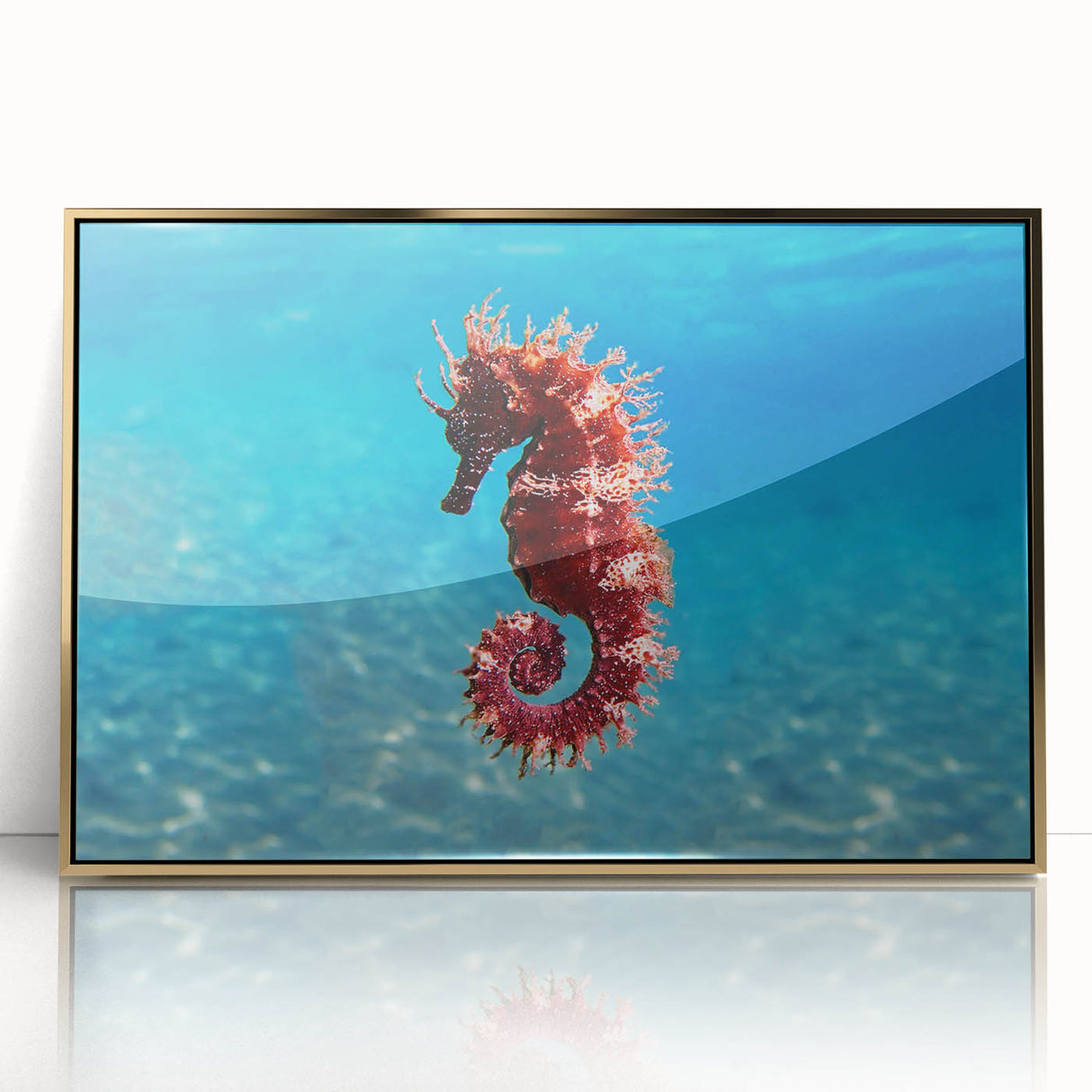 Acrylic print of a Mediterranean seascape in muted blue and gold tones, framed in gold, suitable for modern art wall decor.