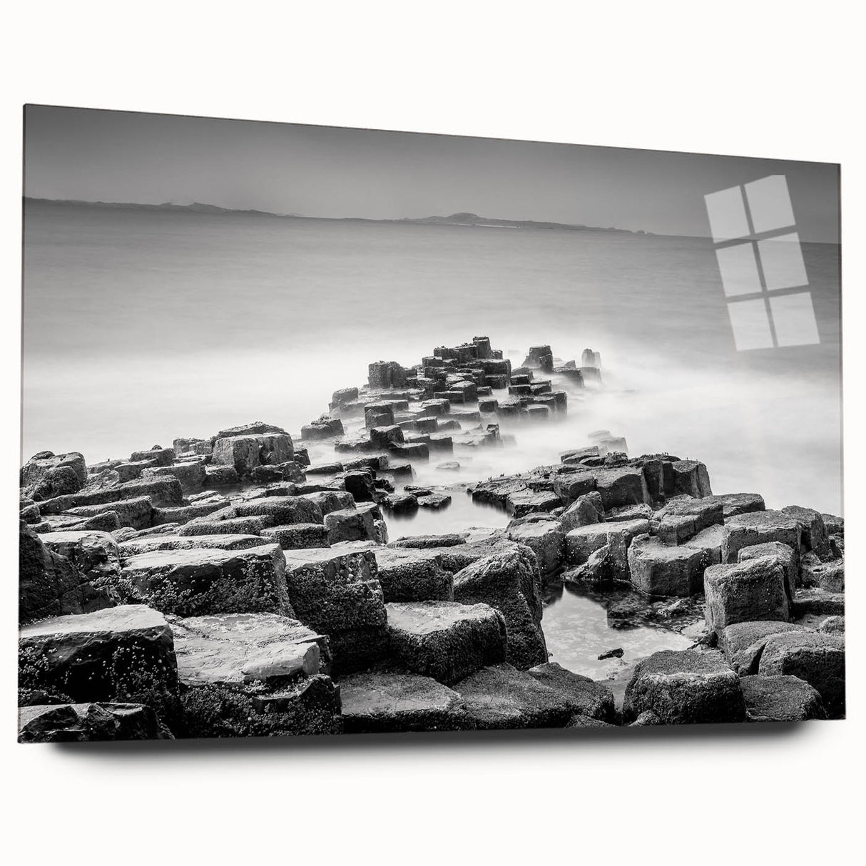 Large abstract wall art of a Northern Ireland scenery in muted green and blue tones on acrylic glass.