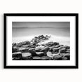 Abstract art print of a colorful, textured landscape on an extra large canvas, framed in black, ideal for living room decor.